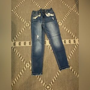 jeans with flower lace around pockets